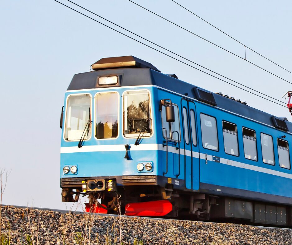A blue regional train on the tracks
