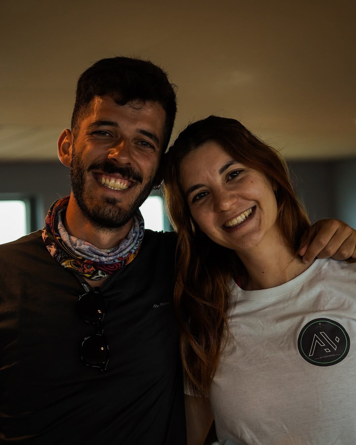 Two participants smiling and hugging