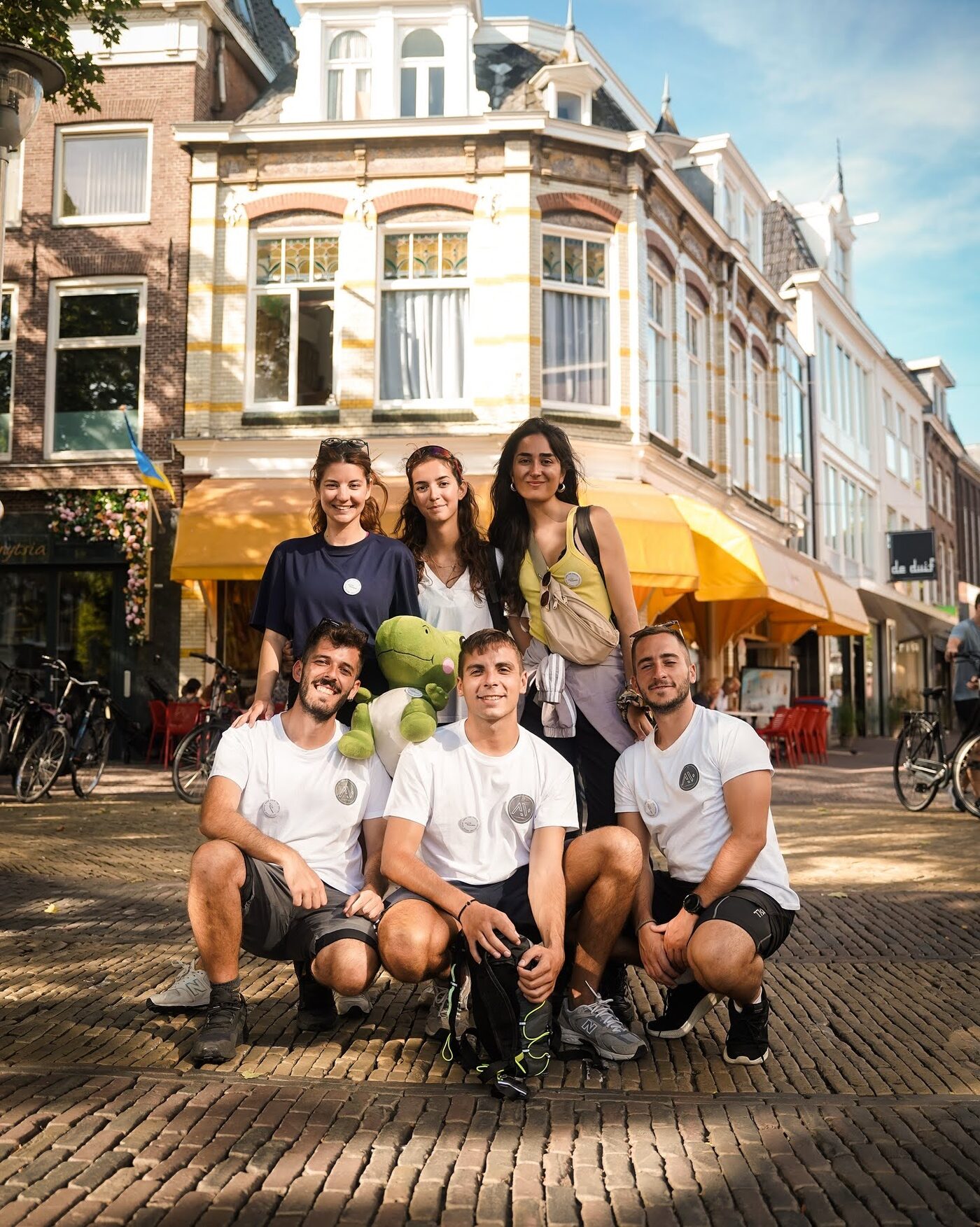 Participants posing together on a street in a Dutch town