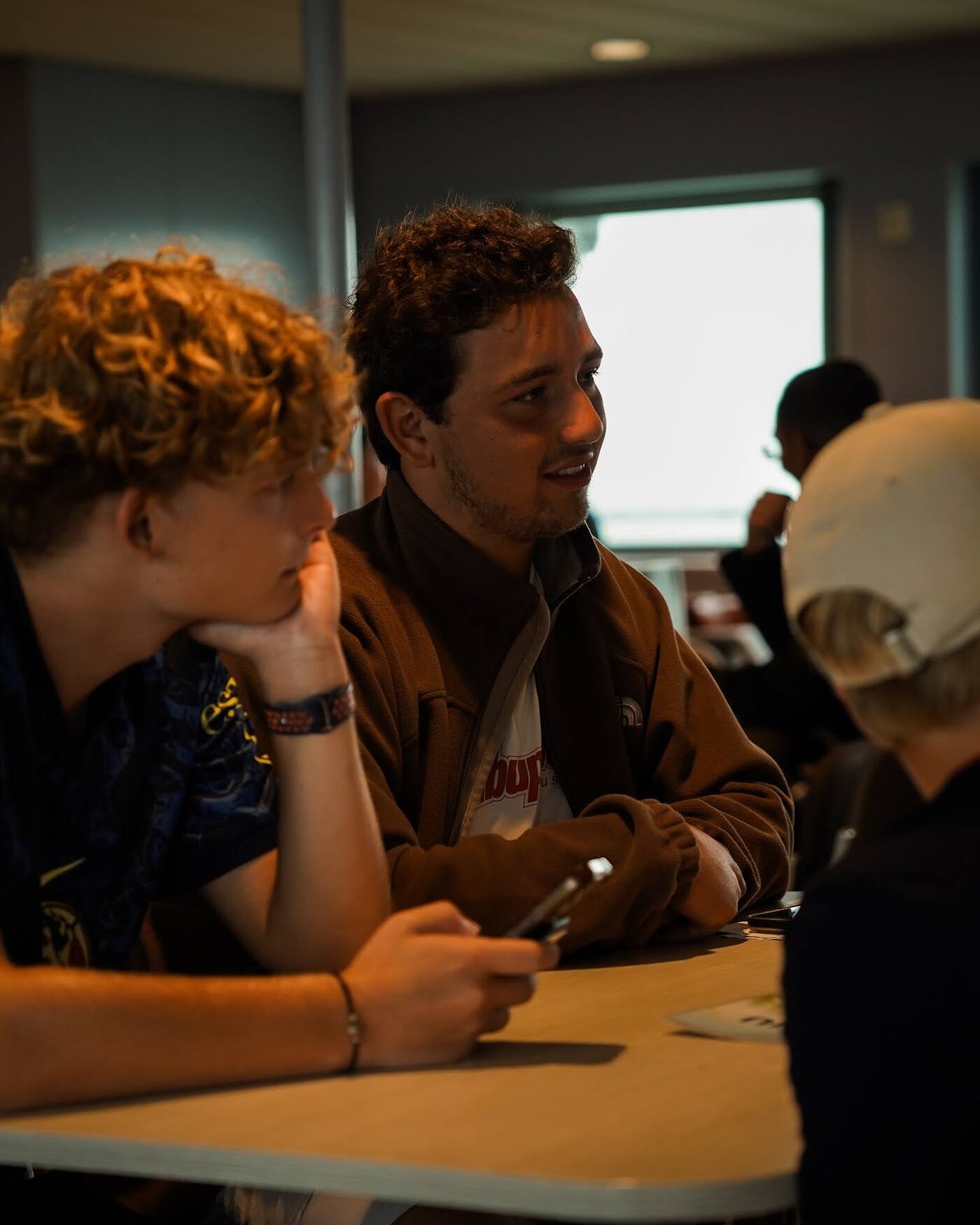 Participants talking around a table
