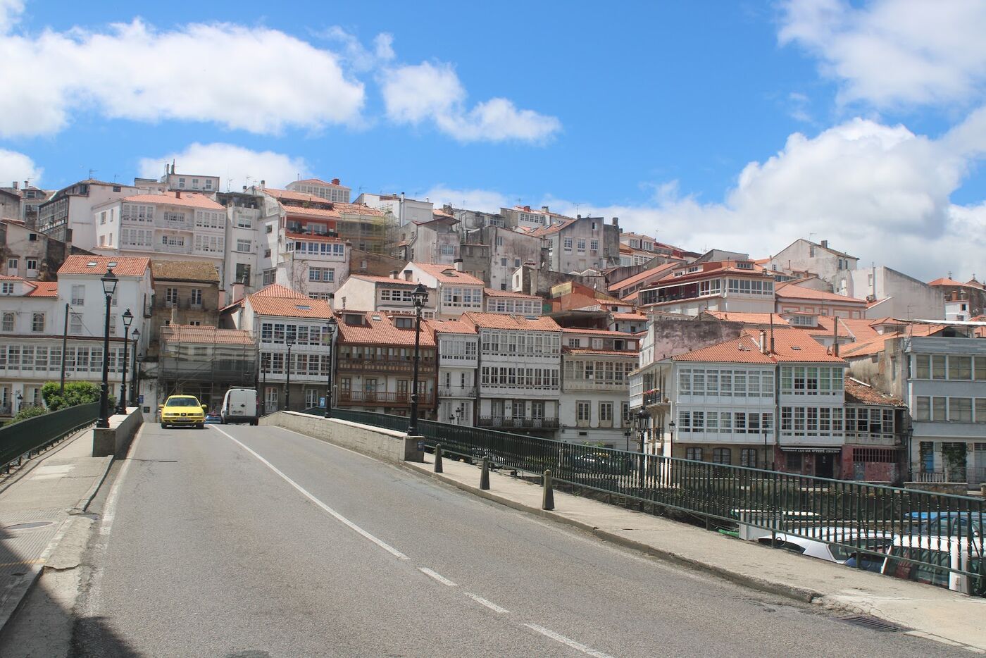 A Galician town of white glazed balconies on a hill